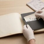 Scanning old family photographs on a flatbed scanner at home