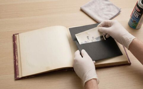 Scanning old family photographs on a flatbed scanner at home